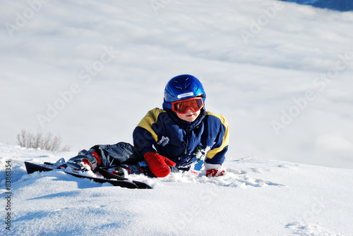 little boy skiing in the alps