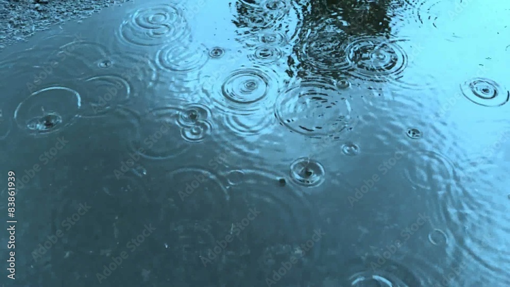 Rain Drops On Water Surface