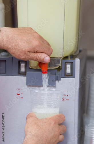 Man pouring lemonade