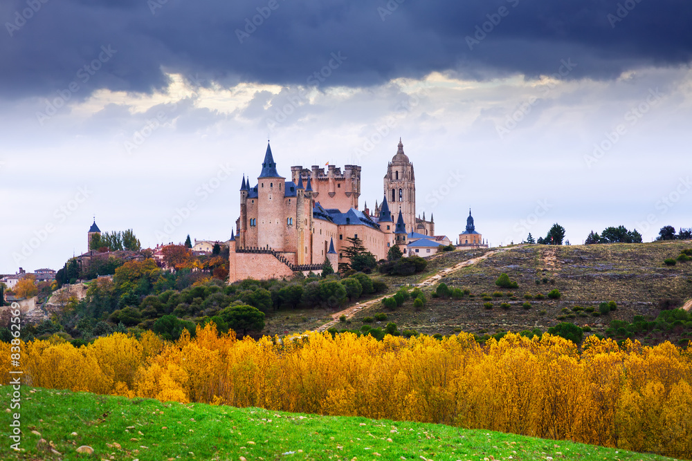Segovia with Alcazar and Cathedra in autumn.
