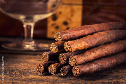 quality cigars on an old wooden table