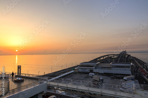 Sunrise from Umihotaru, parking area at Tokyo Bay in Japan photo