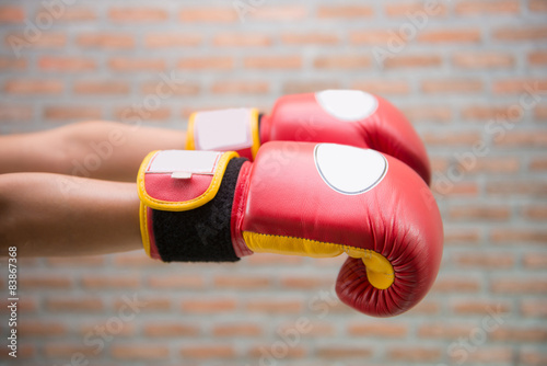Red Boxing Gloves "MUAY THAI" for fight © Sunanta