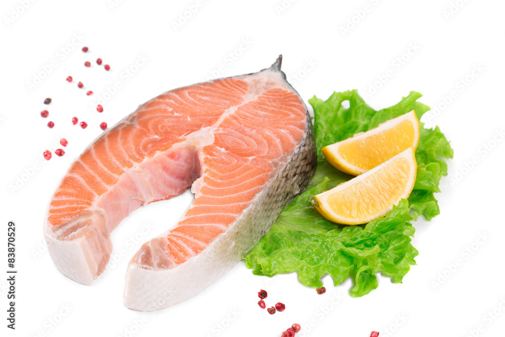 Raw salmon steak with lemon.