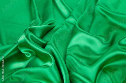 Green silk cloth with some soft folds.