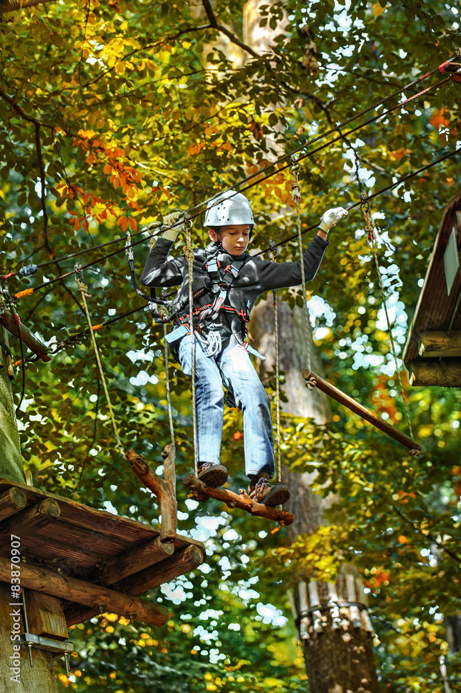 adventure climbing high wire park - people on course in mountain adventure climbing high wire park - people on course in mountain