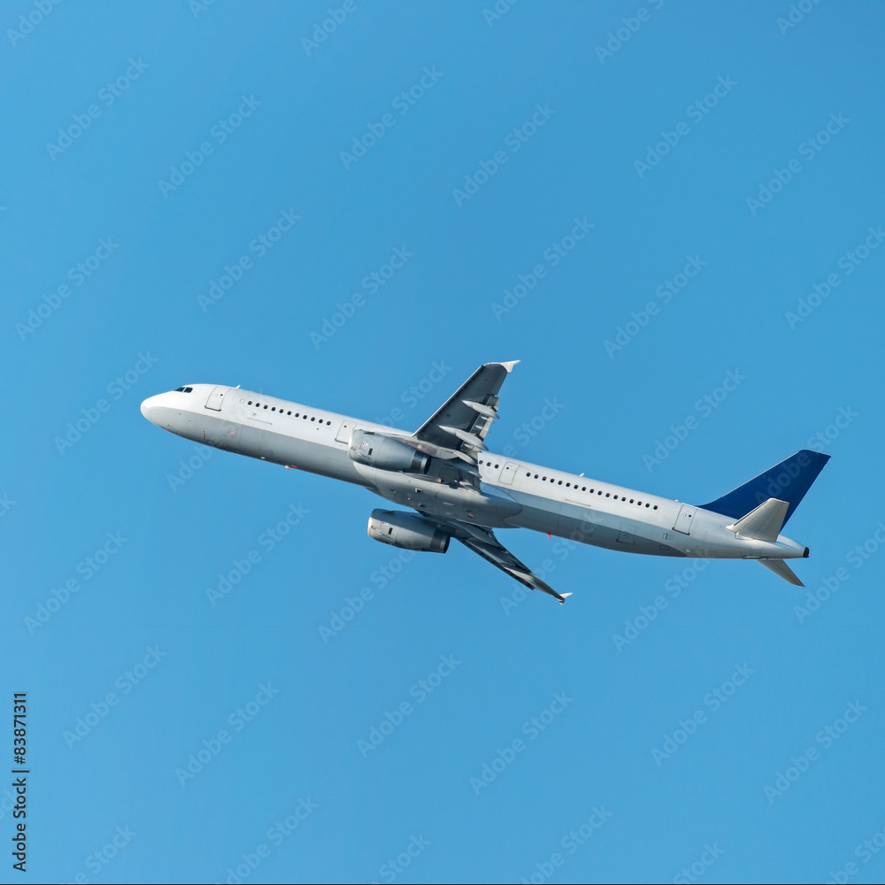 flying up passenger airplane isolated over blue sky background flying up passenger airplane isolated over blue sky background
