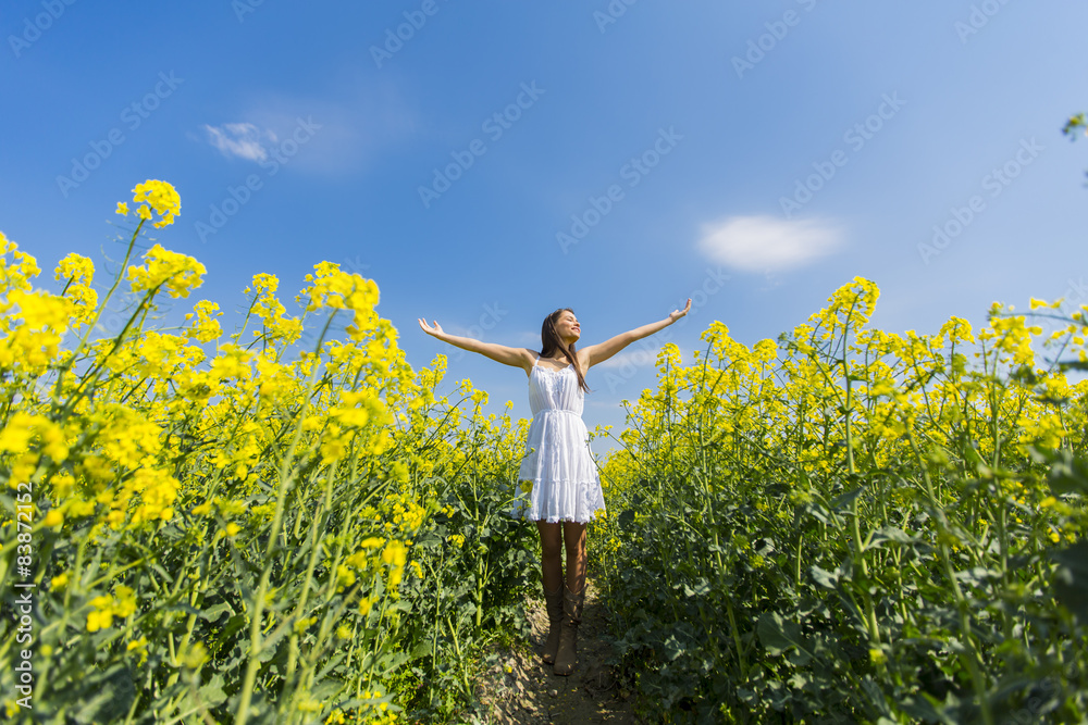 Young woman in the spring field Young woman in the spring field