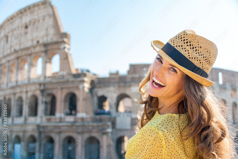 Portrait of laughing woman at Colosseum in Rome in summer