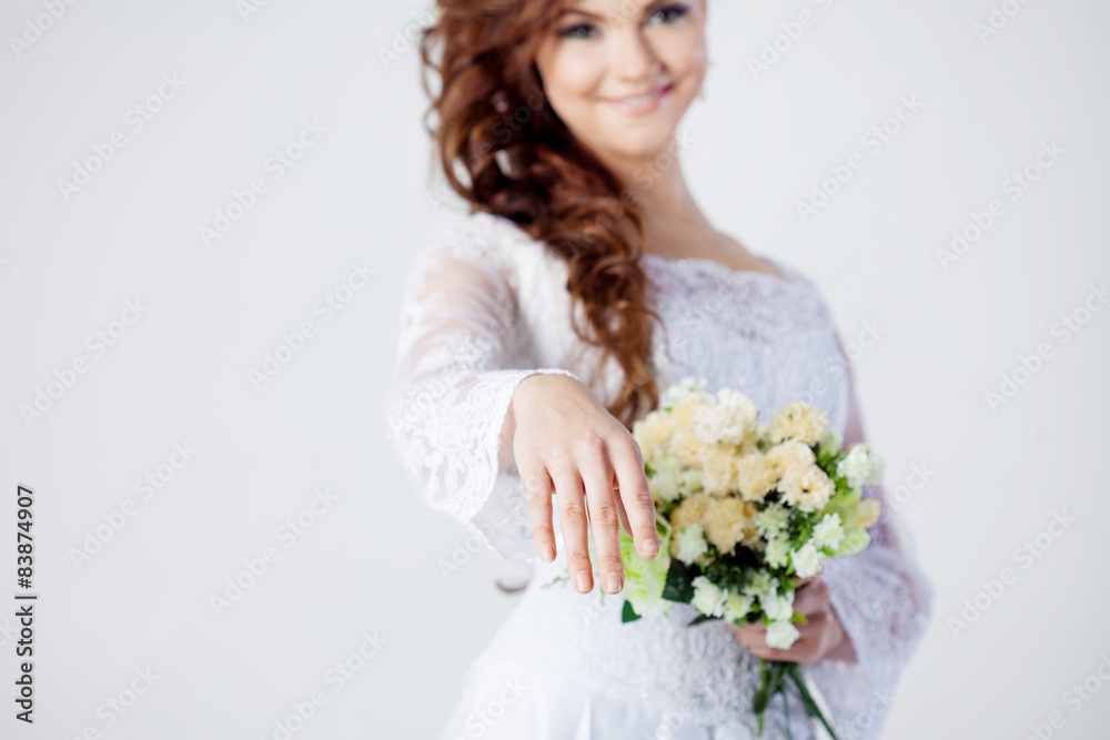 Naklejka premium The bride extends her hand, beautiful smiling woman in a wedding