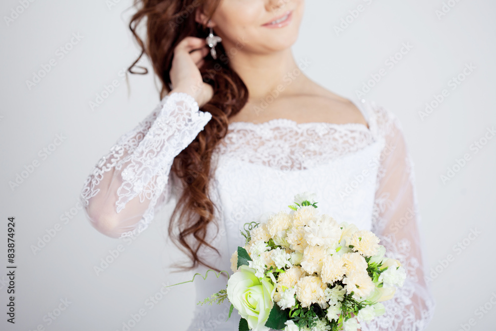 Naklejka premium Portrait of happy bride in wedding dress, white background