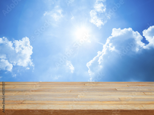 Wallpaper Mural Empty wooden table with blue sky and cloud Torontodigital.ca