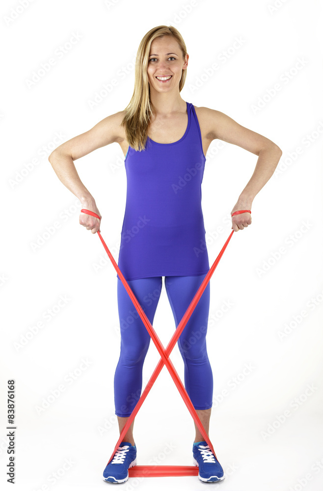 Young woman doing fitness with rubber band Young woman doing fitness with rubber band