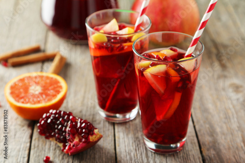 Glasses of sangria on grey wooden background