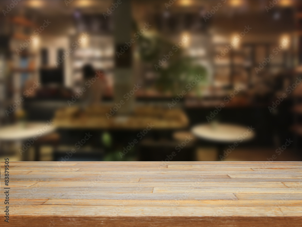 mpty wooden table and blurred cafe background mpty wooden table and blurred cafe background
