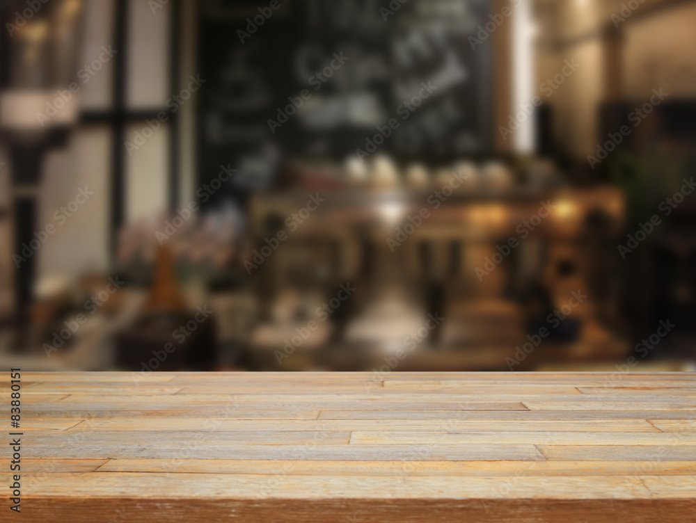 mpty wooden table and blurred cafe background