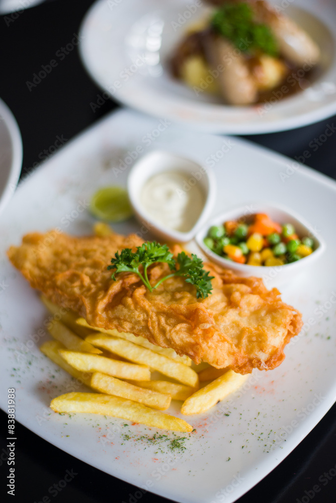 fish and chips served with tartar sauce