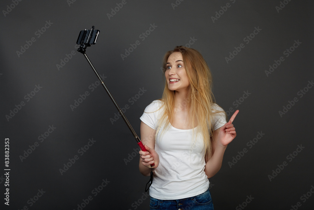 young pretty blonde women taking selfie on cell phone young pretty blonde women taking selfie on cell phone