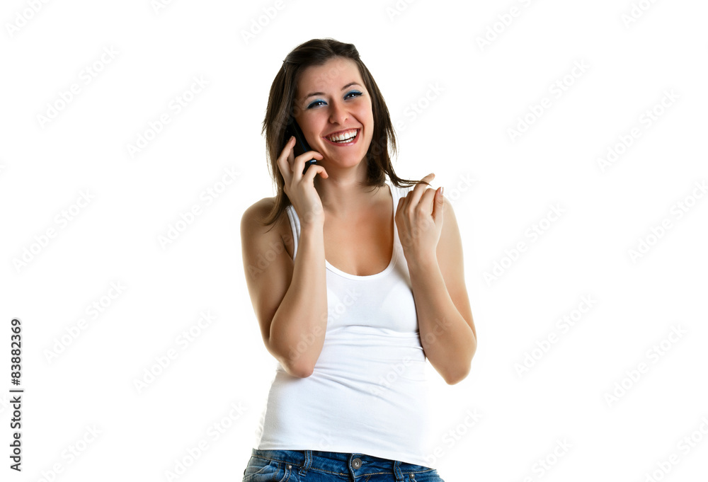Beautiful young woman with white top talking to the phone Beautiful young woman with white top talking to the phone