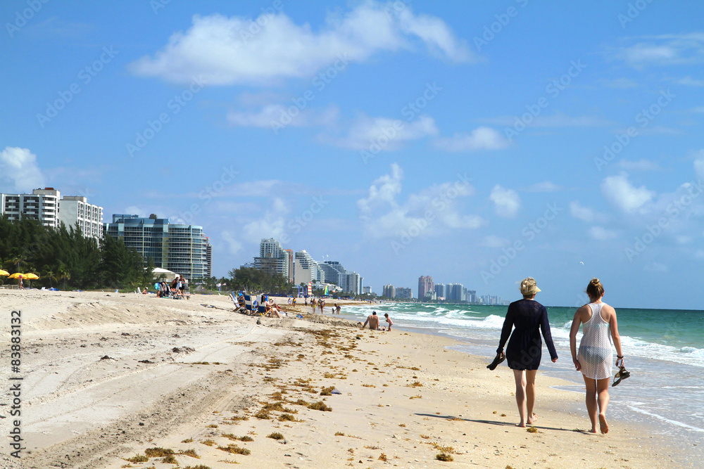 Tourists walking on Fort Lauderdale Beach, Florida, USA Tourists walking on Fort Lauderdale Beach, Florida, USA