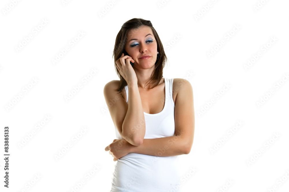 Beautiful young woman with white top talking to the phone Beautiful young woman with white top talking to the phone