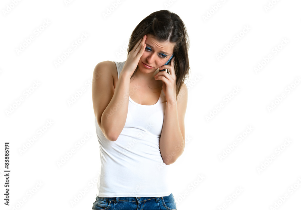Beautiful young woman with white top talking to the phone Beautiful young woman with white top talking to the phone