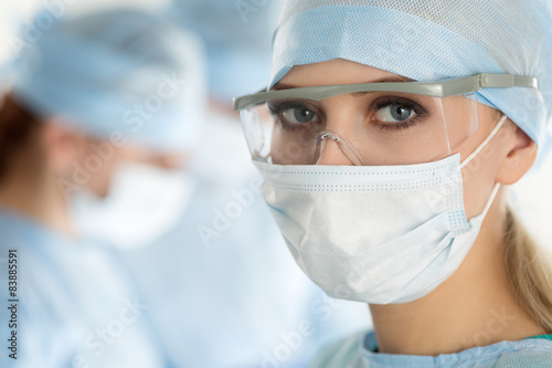 Close-up of surgeon woman looking at camera