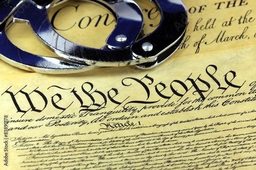 Handcuffs on US constitution The Fourth Amendment photo