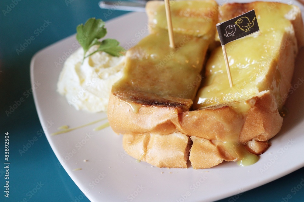 Bread, butter, topped with custard delicious