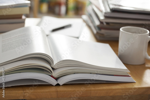 opened book pile put on table