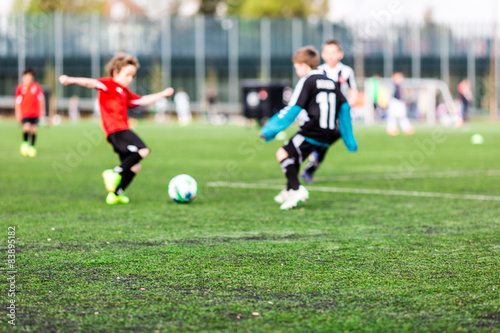 Blur of young boys playing soccer match © Mikkel Bigandt