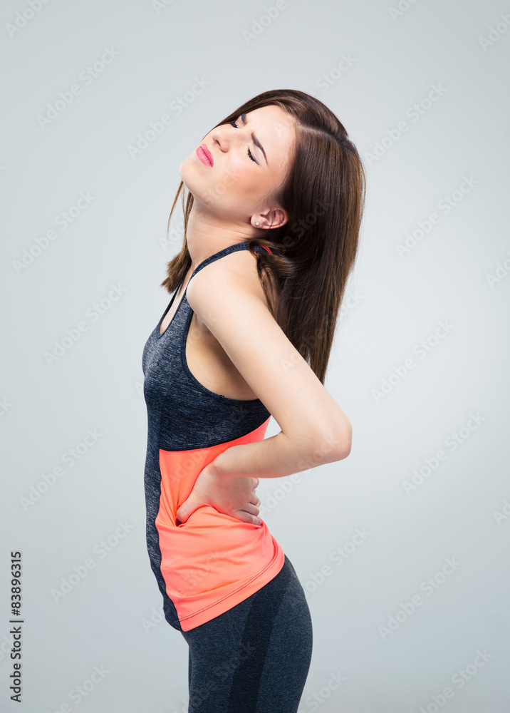 Fitness woman having back pain Fitness woman having back pain