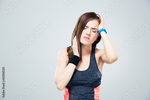 Sports woman having headache