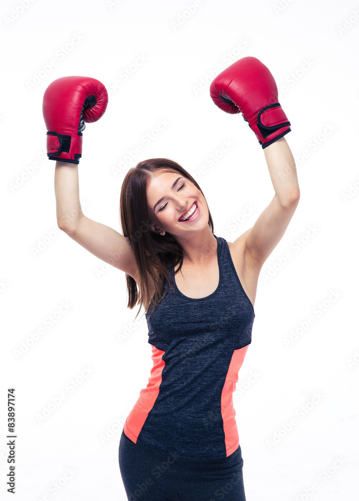 Sporty woman celebrating her victory in boxing gloves