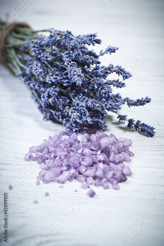 Spa setting with Fresh lavender over wooden background with bath