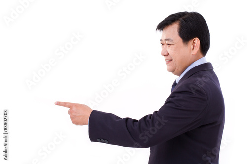senior manager, middle age businessman pointing to blank space