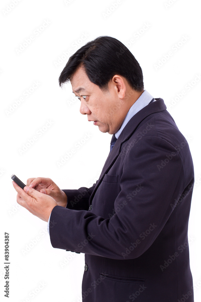 stunned, shocked senior businessman receiving bad news via smart stunned, shocked senior businessman receiving bad news via smart