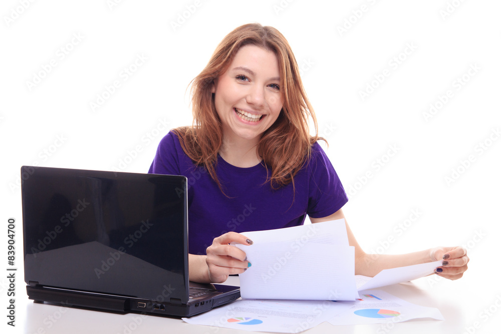 Young girl working at her desk