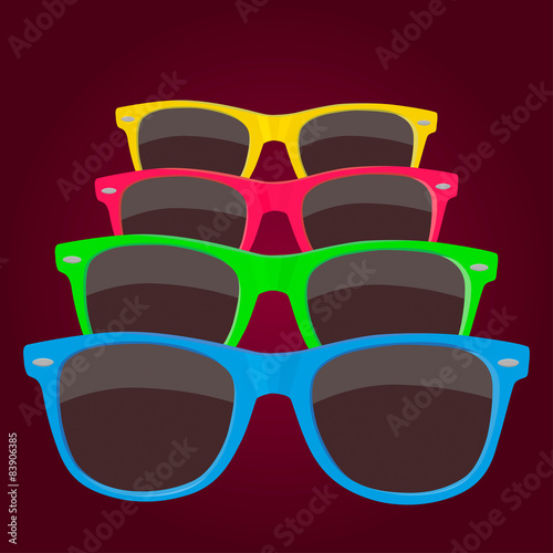 Colorful sunglasses on maroon background