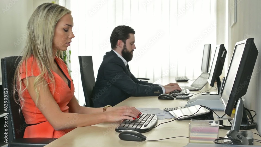 man and woman working on the computer in the office (workers) man and woman working on the computer in the office (workers)