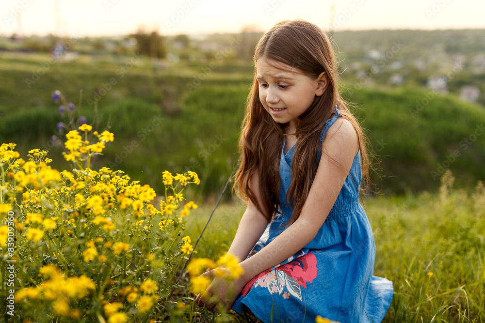 little girl smelling a yellow flower little girl smelling a yellow flower