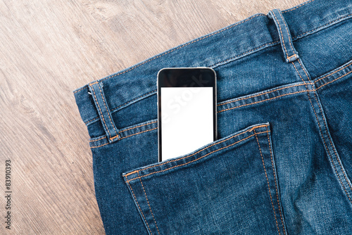Obraz na płótnie Smart phone in your pocket blue jeans on wood table w salonie