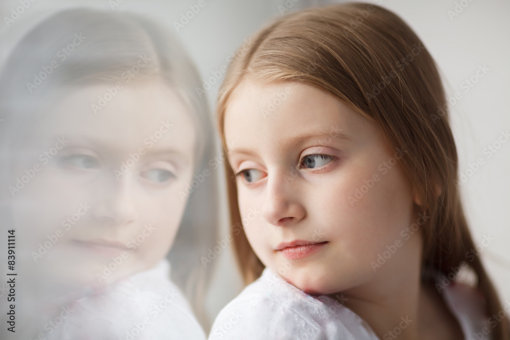 Little girl looking out the window Little girl looking out the window