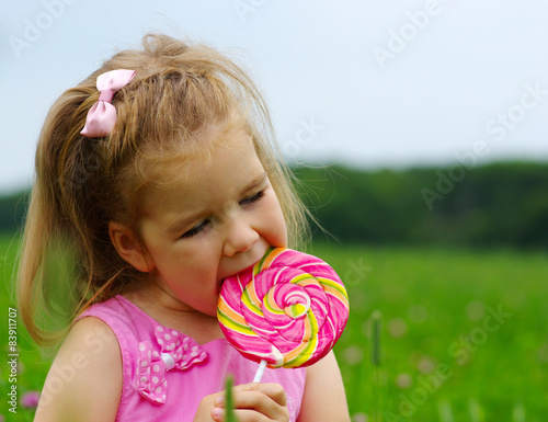  girl eating a lollipop