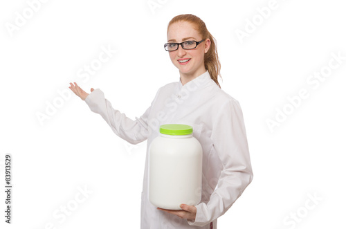 Young female doctor holding jar of protein isolated on white