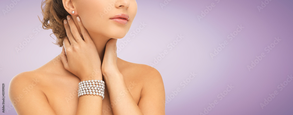 beautiful woman with pearl earrings and bracelet beautiful woman with pearl earrings and bracelet