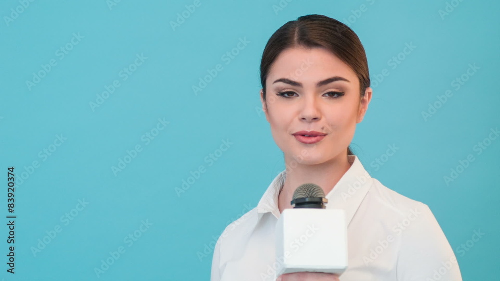 Beautiful girl TV journalist with pretty smile is reporting Beautiful girl TV journalist with pretty smile is reporting