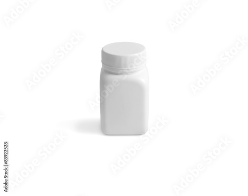 A small white plastic pot for keeping pills isolated on white