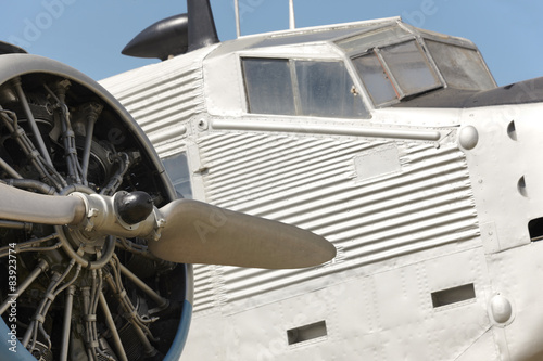 Old fashioned plane with propeller detail photo