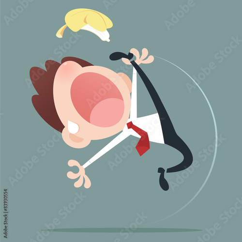 Businessman slipping and falling from a banana peel